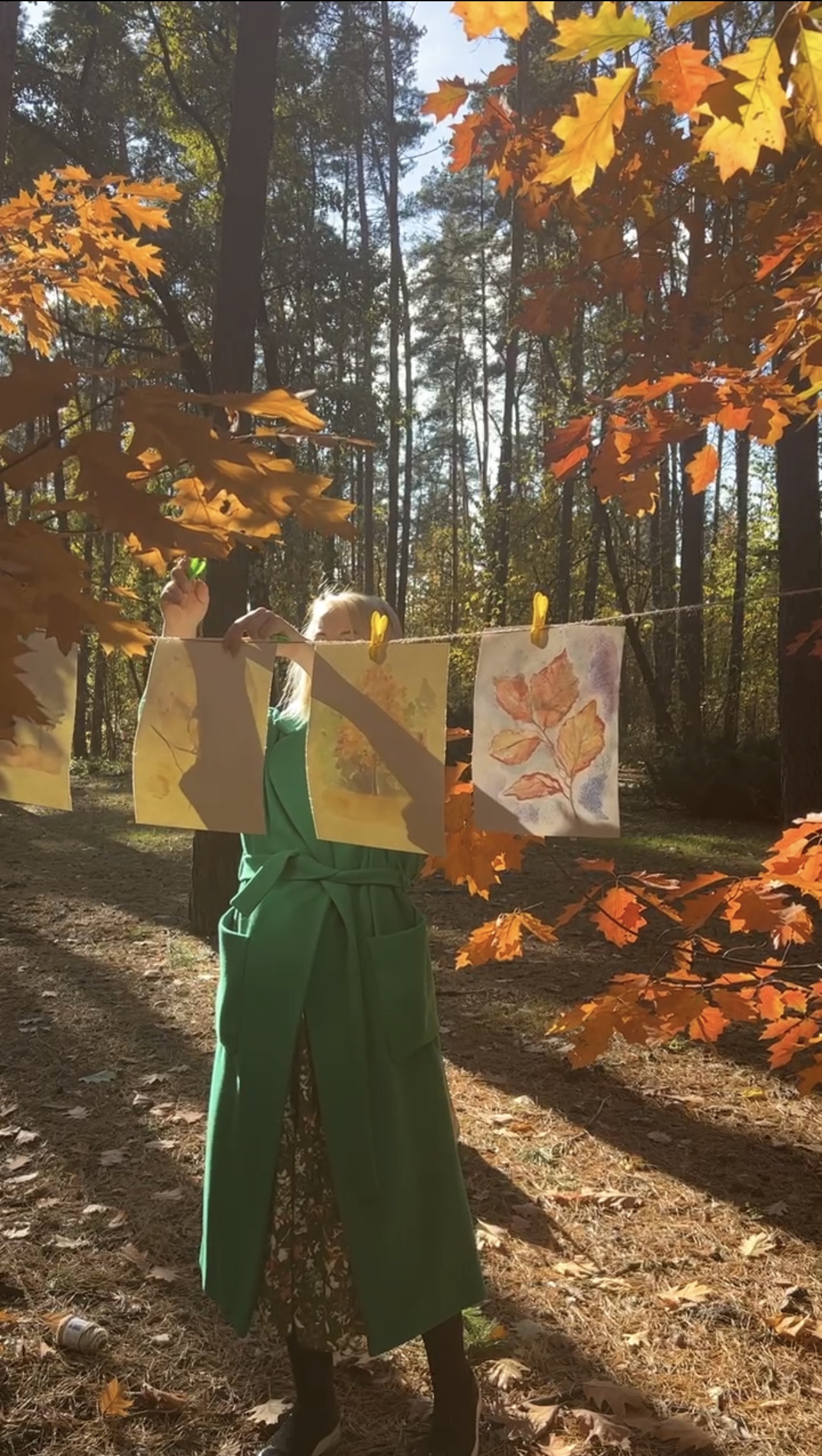 Installing paintings in Marina Stognieva's open-air gallery